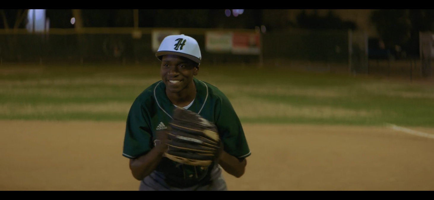 Maurice Mack in a baseball uniform, Throw Like a Girl